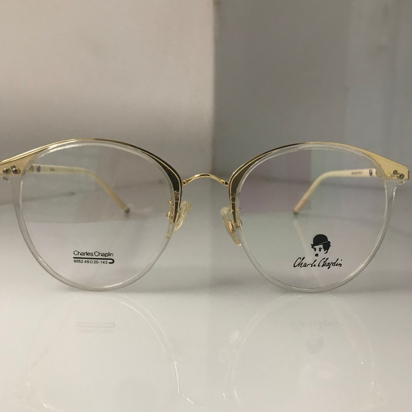 White temples with golden metal frame