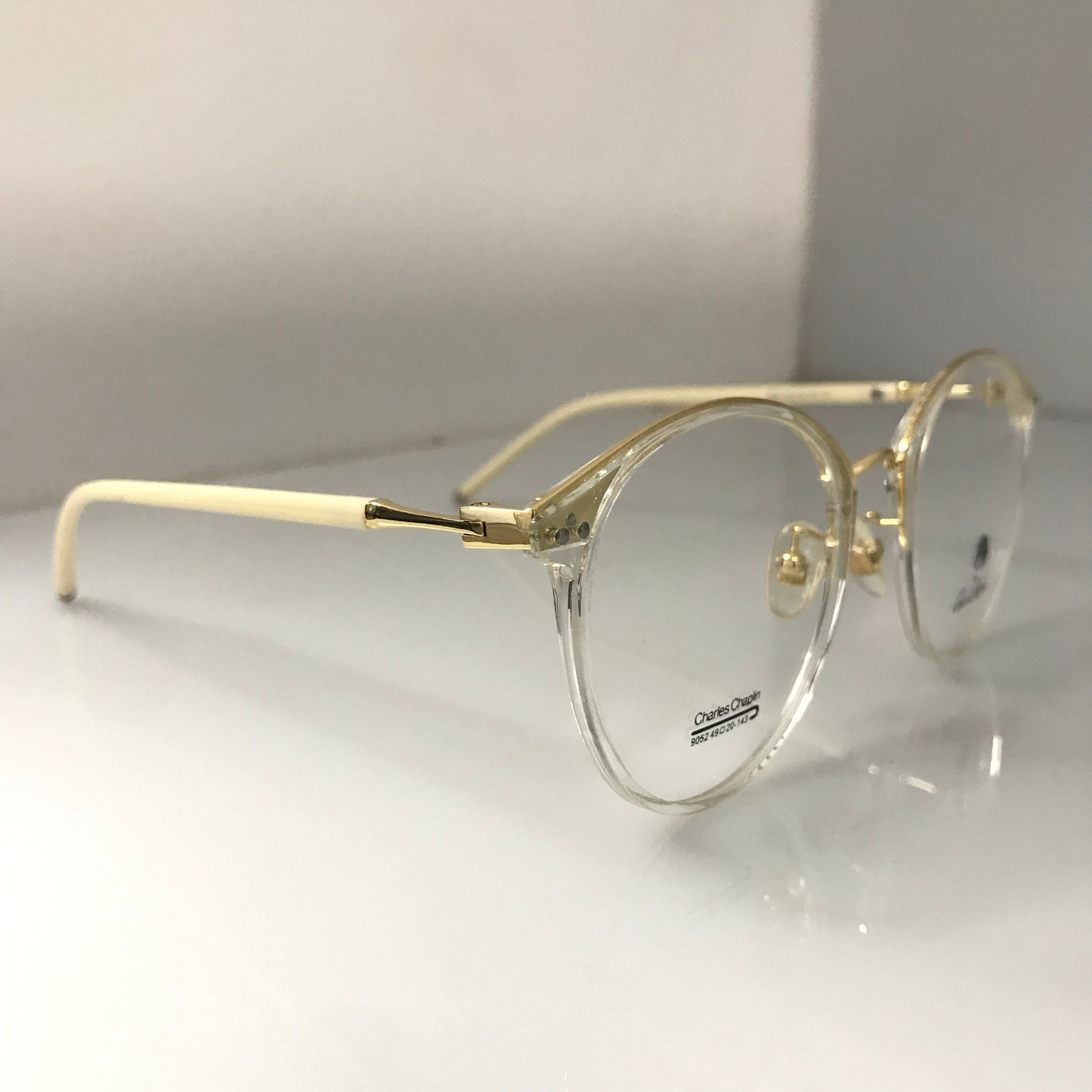 White temples with golden metal frame