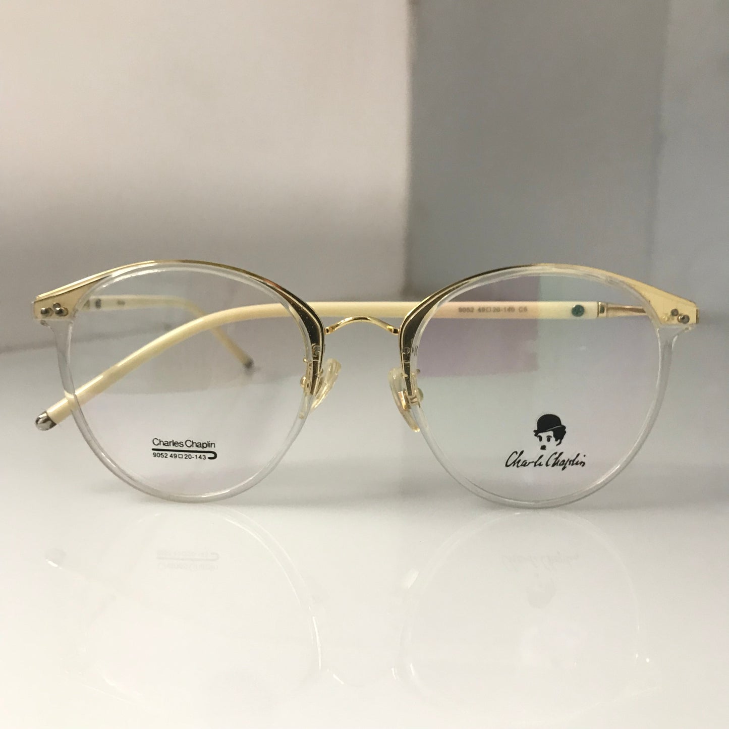 White temples with golden metal frame