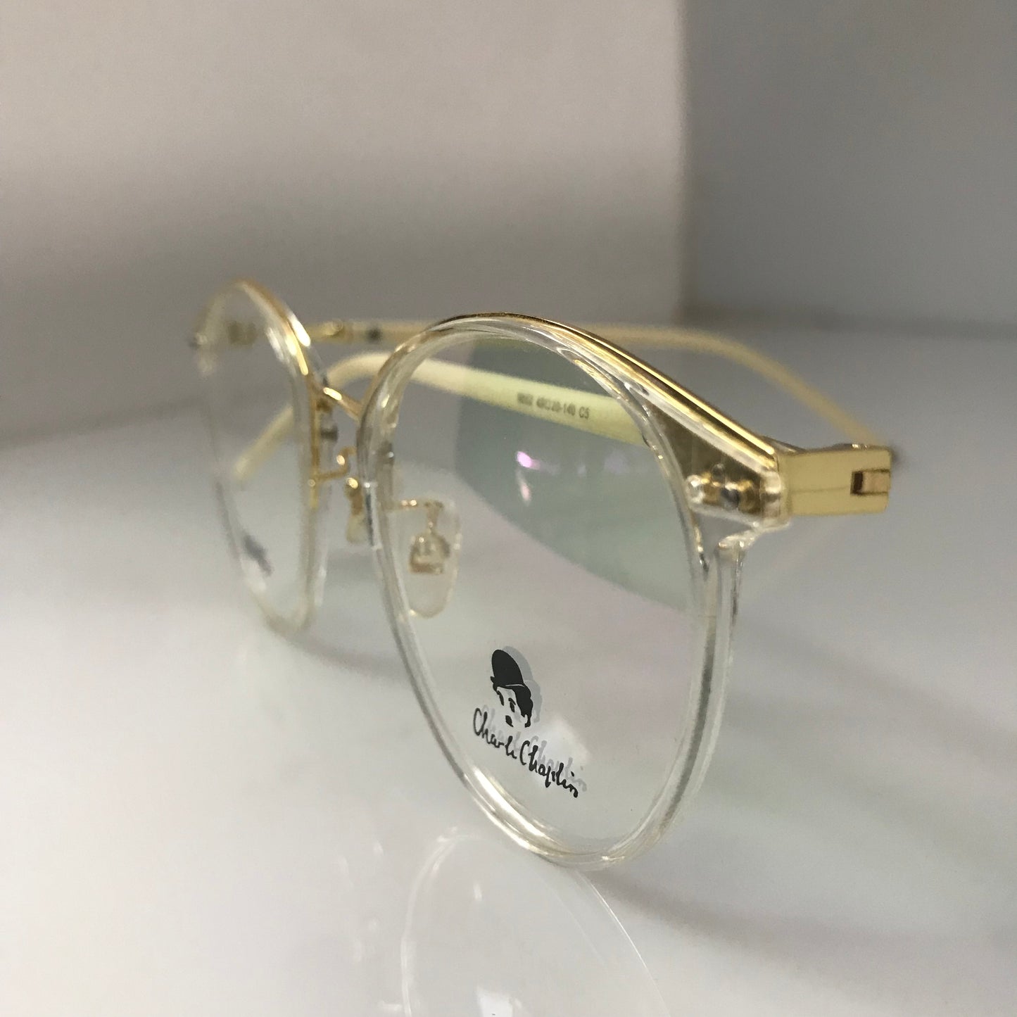 White temples with golden metal frame