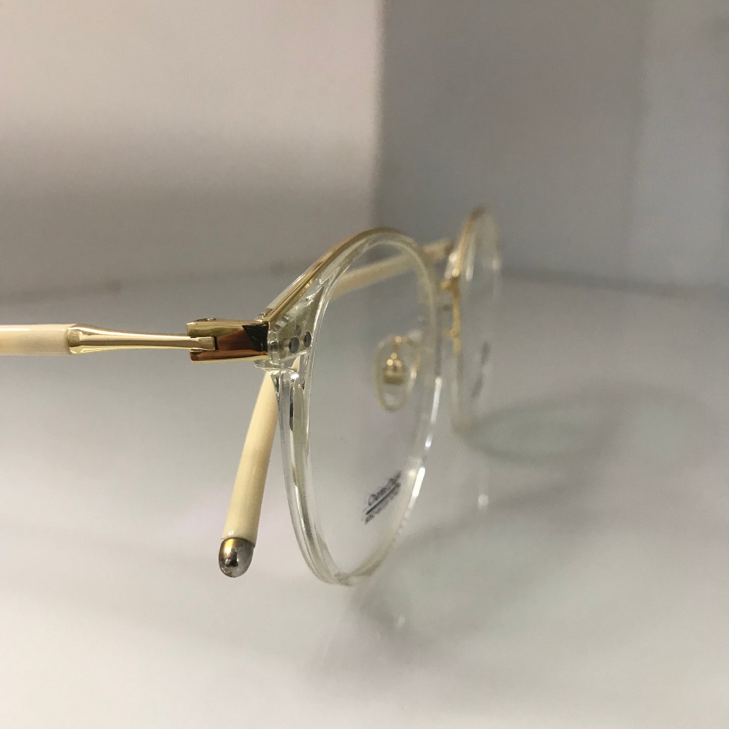 White temples with golden metal frame